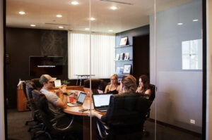 2 male bloggers and 2 female bloggers are discussing on business blogging strategy in a company office discussion room