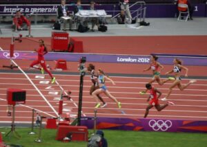 100m women athletes competing for rankings near to finishing line